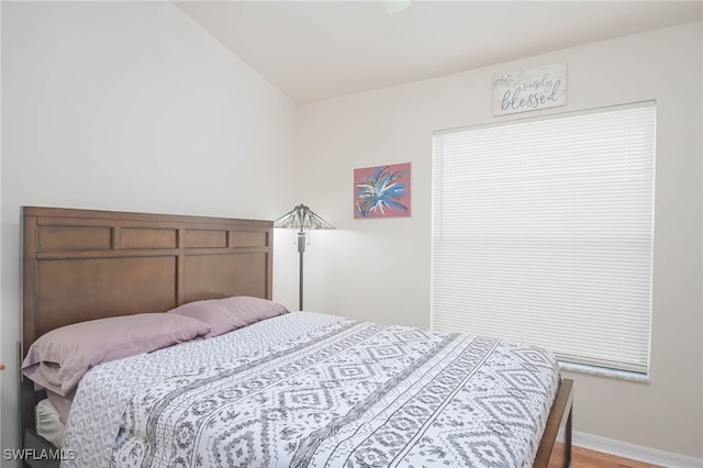 bedroom with hardwood / wood-style floors