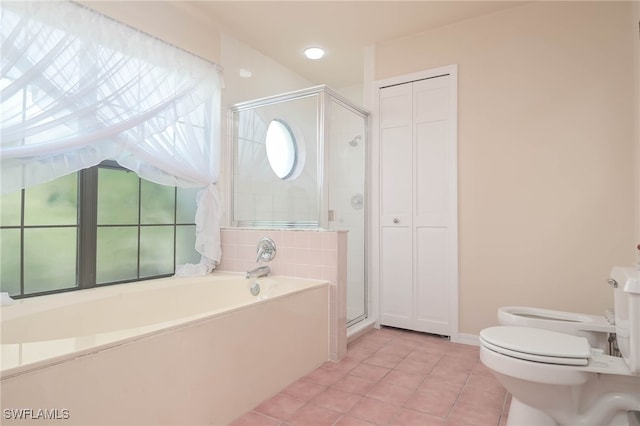 bathroom featuring a bidet, tile patterned flooring, independent shower and bath, and toilet