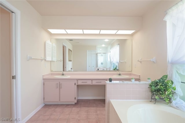 bathroom featuring shower with separate bathtub, tile patterned floors, and vanity