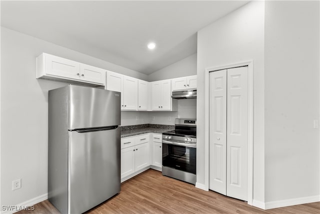 kitchen featuring white cabinets, stainless steel appliances, light hardwood / wood-style flooring, and lofted ceiling