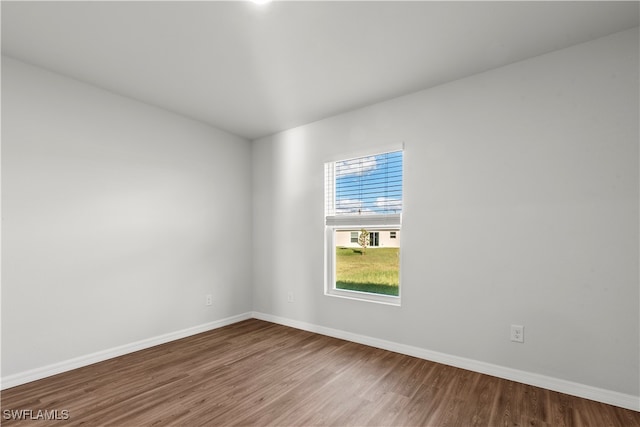 spare room with wood-type flooring