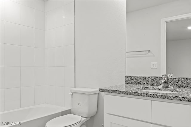 full bathroom featuring vanity, toilet, and tiled shower / bath