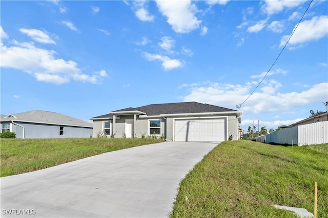 view of front of property featuring a garage and a front yard