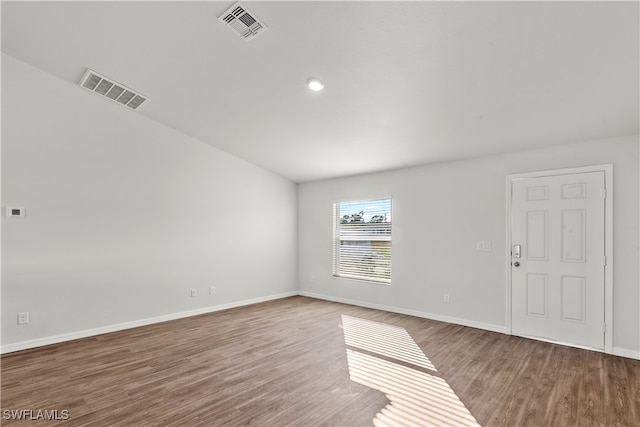 empty room with hardwood / wood-style floors