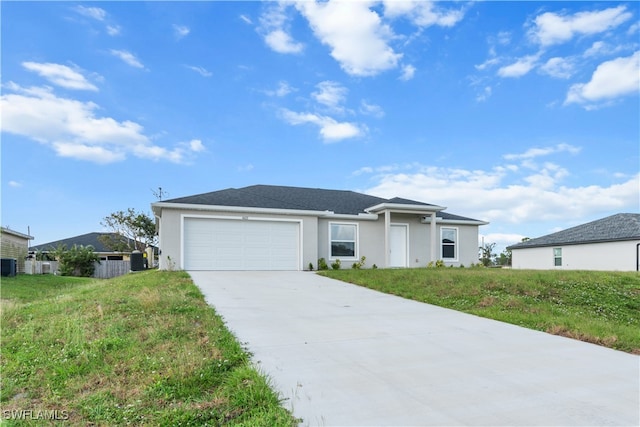 ranch-style home featuring a garage and a front lawn