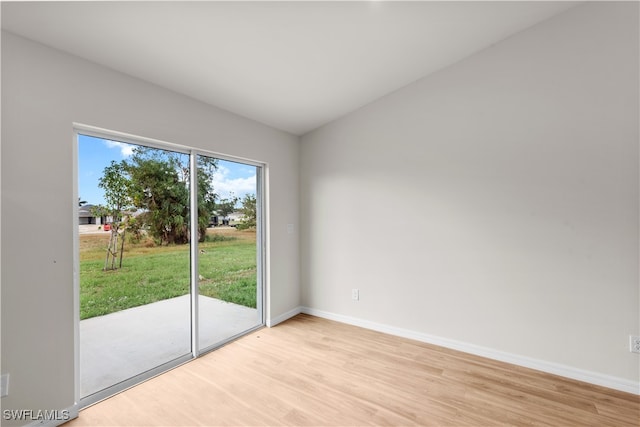 spare room featuring light hardwood / wood-style floors