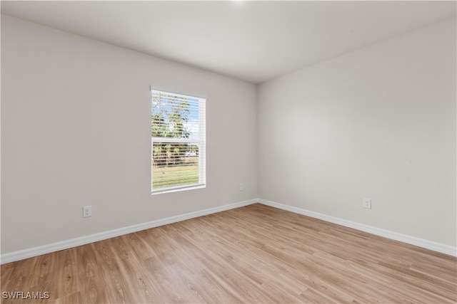 spare room featuring light wood-type flooring