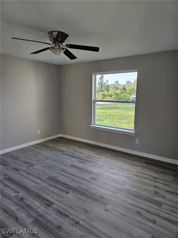 empty room featuring wood-type flooring and ceiling fan