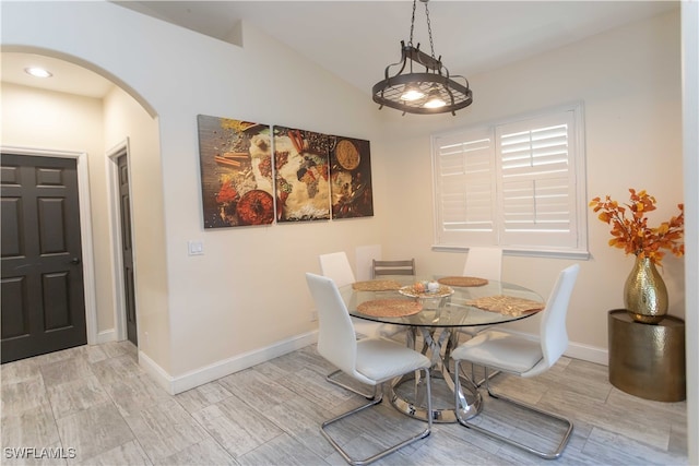 dining room featuring lofted ceiling