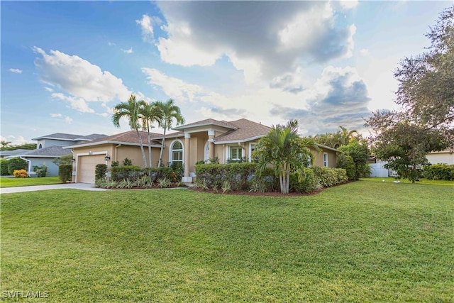 ranch-style home with a garage and a front lawn