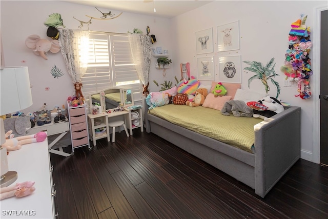 bedroom with dark wood-type flooring