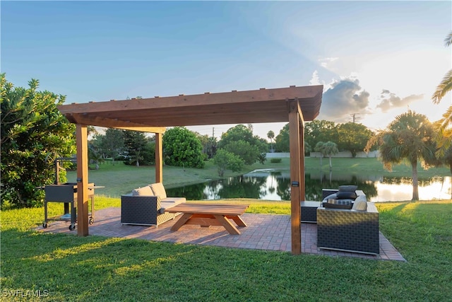 exterior space with a pergola and a water view