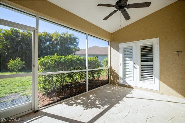 20730 Groveline Ct, Estero, FL 33928 - unfurnished sunroom featuring vaulted ceiling, ceiling fan, and french doors