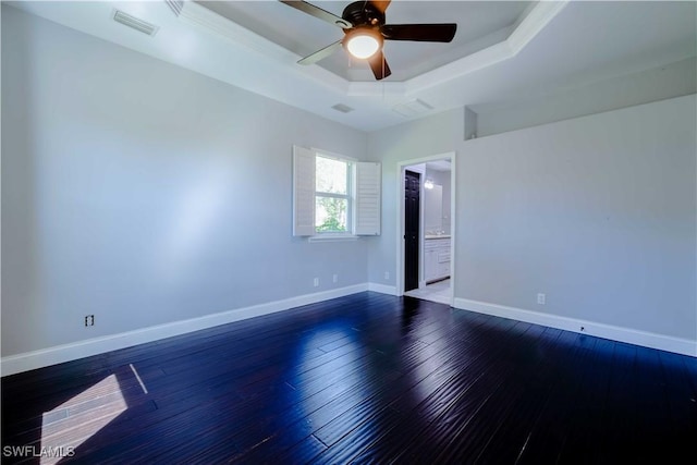 20730 Groveline Ct, Estero, FL 33928 - spare room featuring a raised ceiling, ceiling fan, and dark wood finished floors