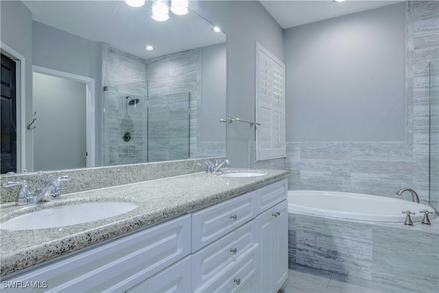 20730 Groveline Ct, Estero, FL 33928 - full bath with a shower stall, double vanity, a garden tub, and recessed lighting