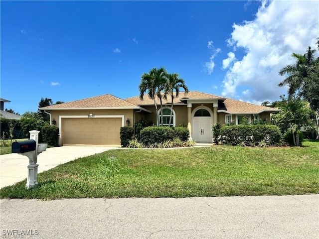 20730 Groveline Ct, Estero, FL 33928 - ranch-style home with stucco siding, a garage, a front lawn, and concrete driveway