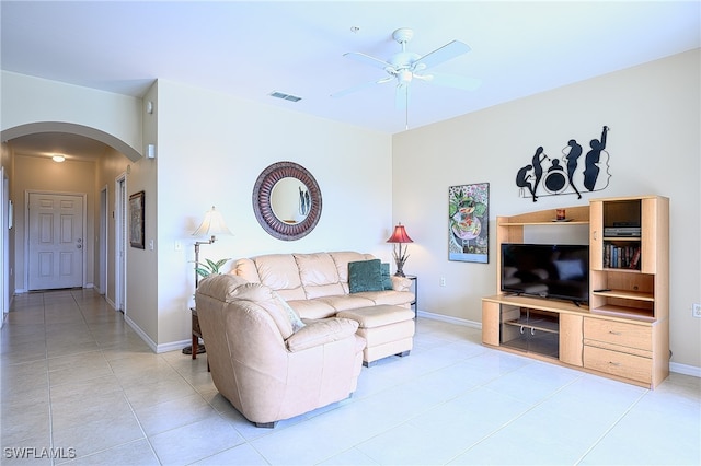 living room featuring ceiling fan and light tile patterned flooring