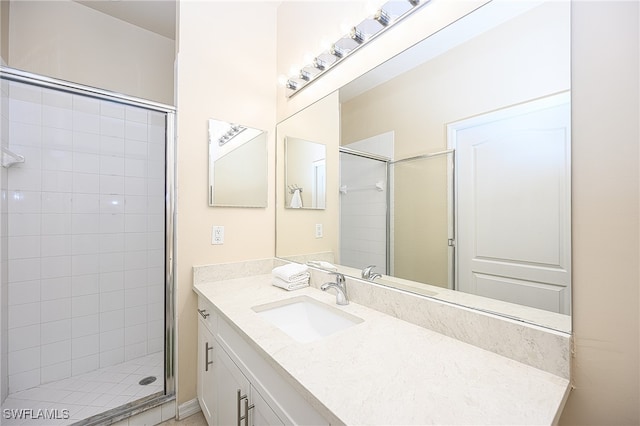 bathroom featuring vanity and walk in shower