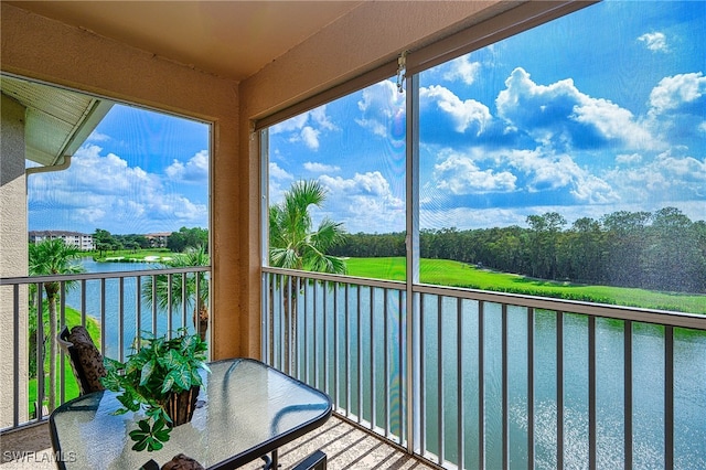 balcony featuring a water view