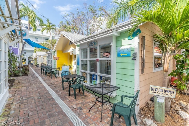 view of side of property featuring a patio