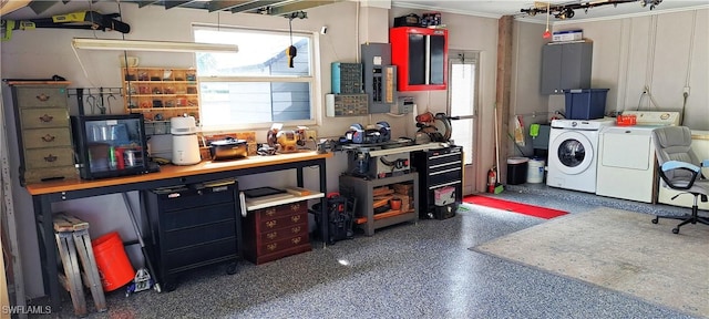 interior space with a workshop area and washing machine and clothes dryer