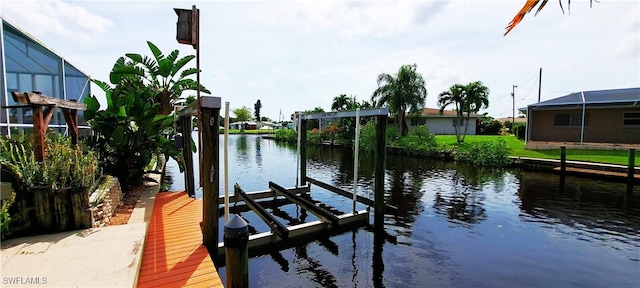 dock area featuring a water view and boat lift