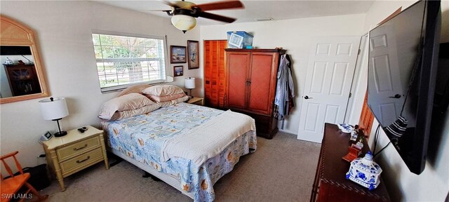 bedroom with ceiling fan and carpet