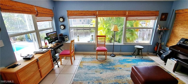 sitting room featuring a wealth of natural light and light tile patterned flooring