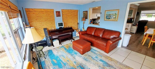 living room with tile patterned floors