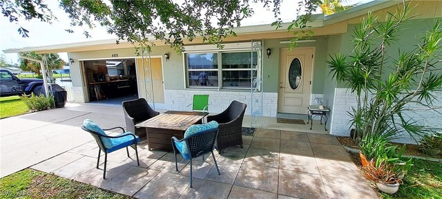 view of patio featuring a garage