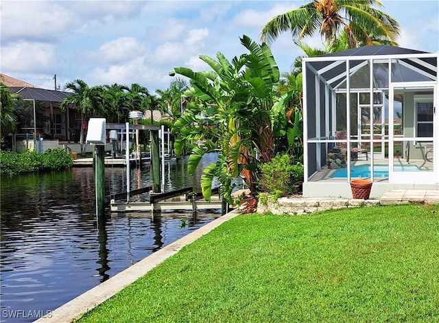 dock area with glass enclosure, an outdoor pool, a lawn, and a water view