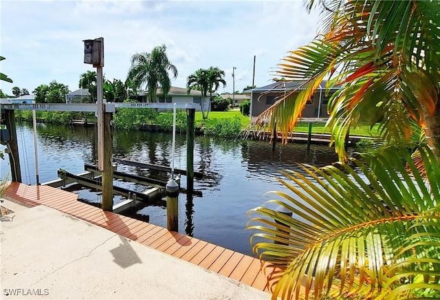 view of dock featuring a water view and boat lift