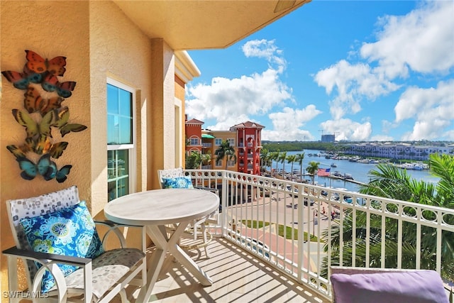 balcony featuring a water view