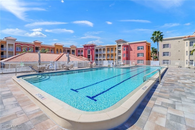 view of swimming pool with a patio