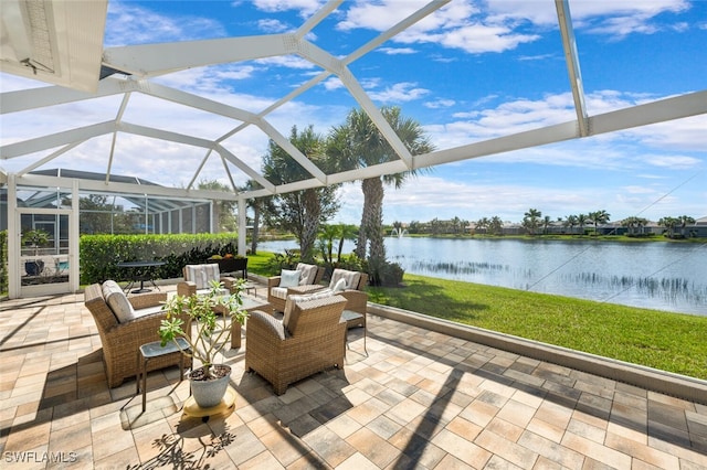 view of patio featuring a lanai, a water view, and an outdoor hangout area