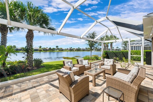 view of patio with a lanai, an outdoor living space, and a water view