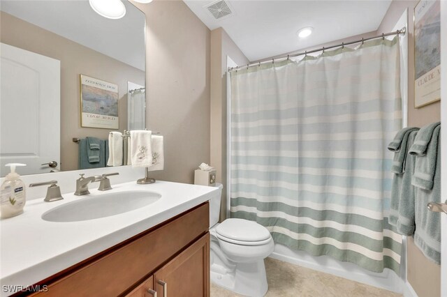 full bathroom with toilet, tile patterned floors, visible vents, and vanity