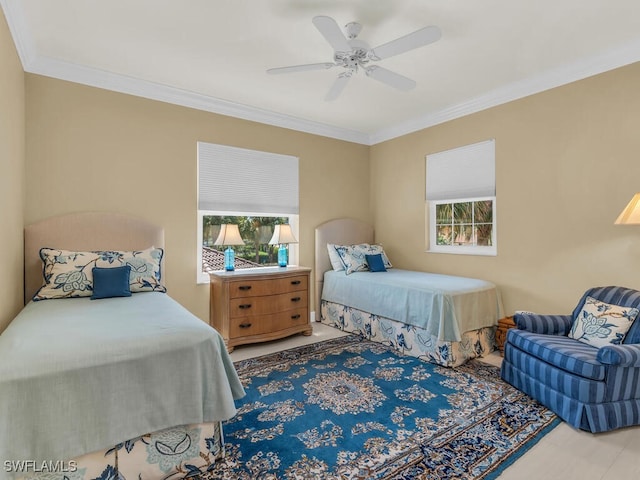 bedroom featuring ceiling fan and crown molding