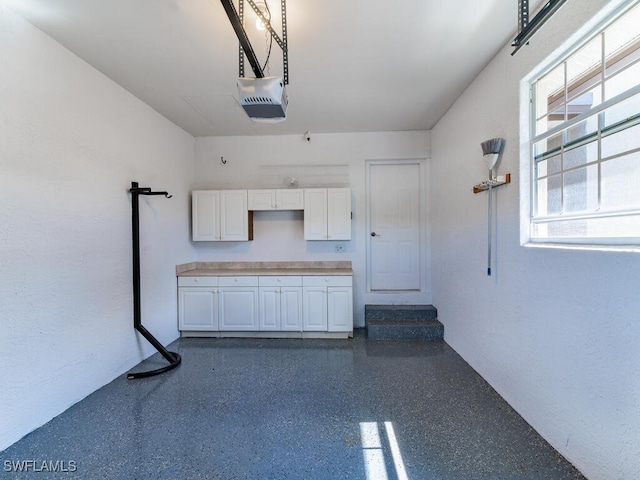1105 Gayer Way Unit A-202, Marco Island, FL 34145 - garage featuring a garage door opener