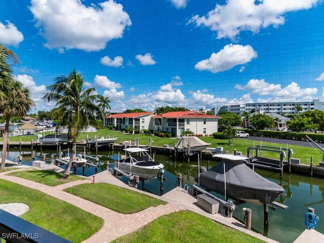 1105 Gayer Way Unit A-202, Marco Island, FL 34145 - dock featuring boat lift, a water view, and a lawn