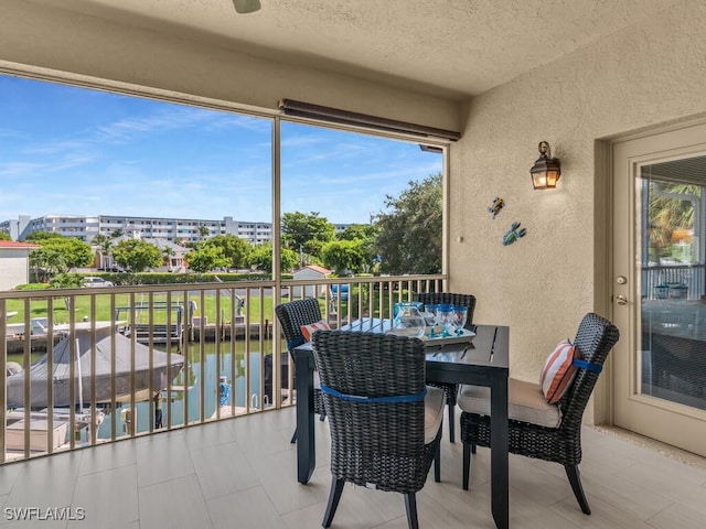 balcony featuring a water view