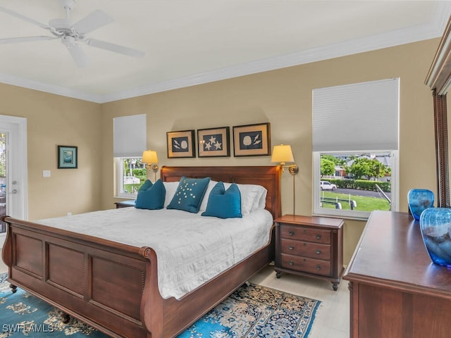 bedroom featuring crown molding and ceiling fan