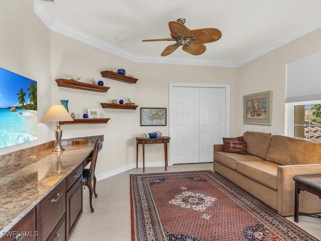 tiled living room with ornamental molding and ceiling fan