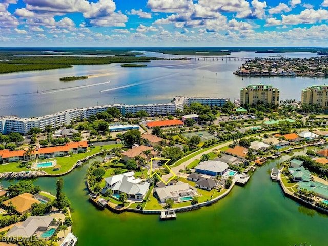 birds eye view of property with a water view