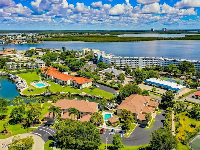 birds eye view of property with a water view