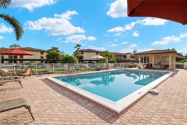 view of swimming pool with a patio