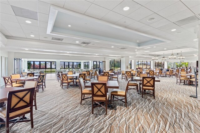 dining space with a tray ceiling