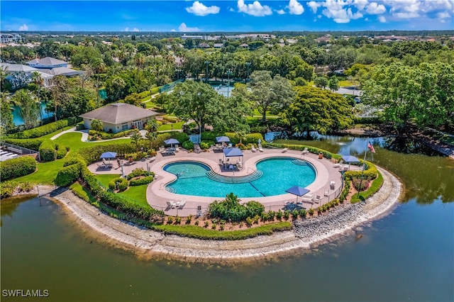 birds eye view of property with a water view