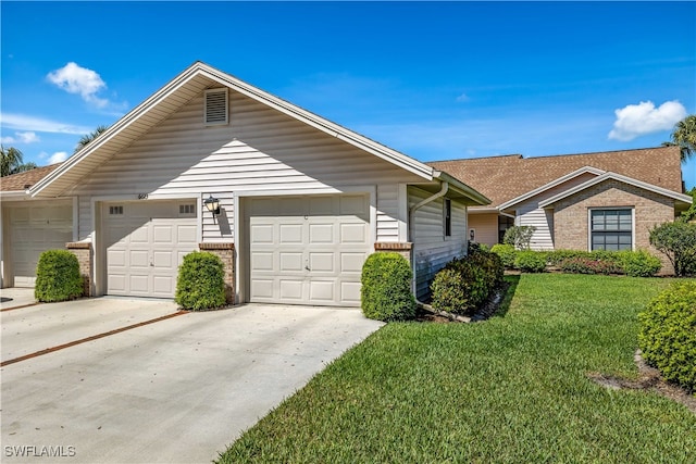 single story home featuring a garage and a front yard