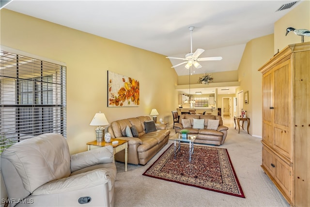 carpeted living room with high vaulted ceiling and ceiling fan